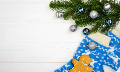 Festive Christmas composition with a Christmas decorations, knitted socks and gingerbread man on a...