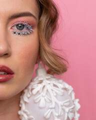 Girl Chrismass earing MakeUp Pink background Blue eyes Close eyes 2 CloseUp Beauty model Passion