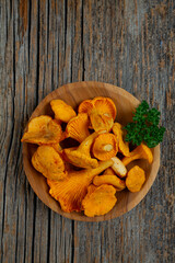 chanterelle mushrooms on wooden surface