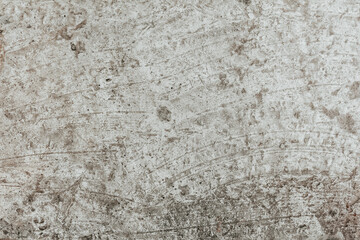 A concrete wall texture with cracks and scratches. Abstract background, old cement wall.