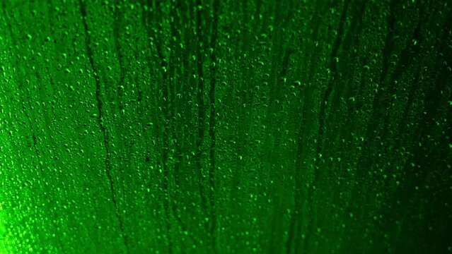 Green Water Drops on a Shower Glass in Switzerland.