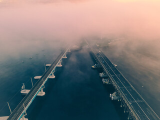 A Foggy morning at Fremantle road and rail bridges, Misty swan river from above. 