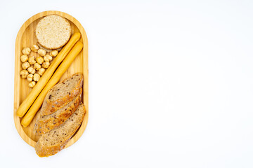 Traditional bread and nuts on a wooden tray on a white background