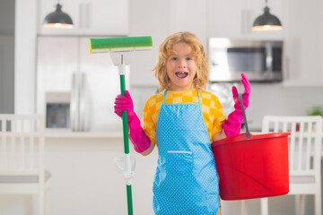 Portrait of child helping with housework, cleaning the house. Housekeeping, home chores.