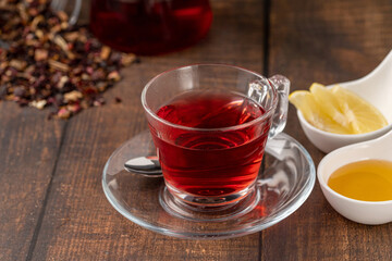 Freshly brewed hot winter tea on a wooden table