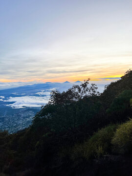 Panorama of flowing fog waves on mountain tropical rainforest, image over the clouds Amazing nature background with clouds and mountain peaks in Purbalingga.