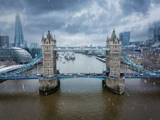 Wall murals Tower Bridge Aerial view of the Tower Bridge in London, England, with snow and ice during winter time