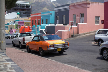 an old rusty sports car on the street of Cape town