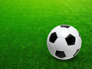 Fototapeta premium Soccer ball on the green grass