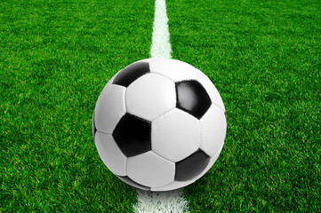 Soccer ball on stadium field texture