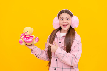 Gift of love just for you. Happy child point finger at teddy bear. Valentines gift. Toy present