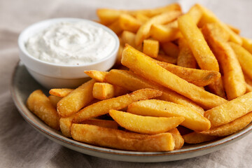 Homemade French Fries with Ranch Dressing on a Plate, side view. Close-up.