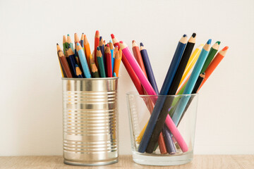 Colored drawing pencils closeup on white background