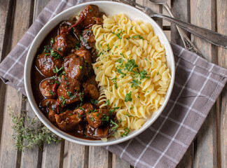 Poultry goulash with pasta on a plate. Cooked with low fat turkey breast