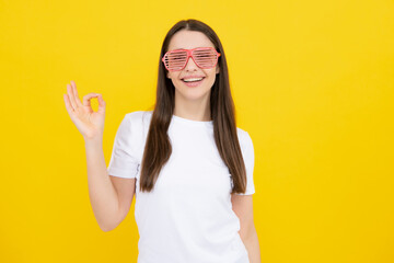 Portrait of beautiful woman with funny glasses. Celebration and party. Girl having fun, portrait on...