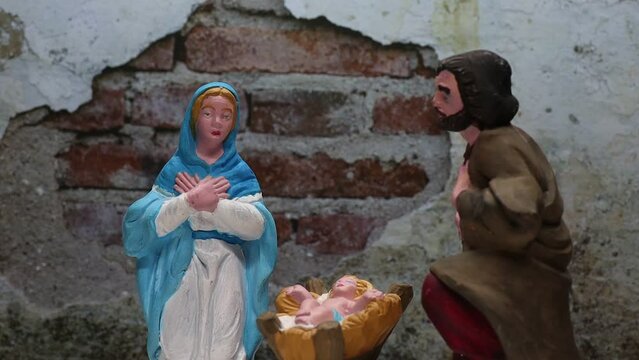 Christmas nativity scene. Sacred figures in an Italian presepe rotating.