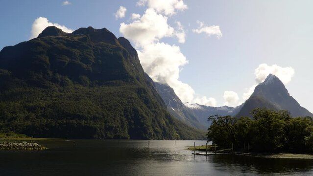 Beautiful natural landscape seen from Milford Sound harbor. Time lapse