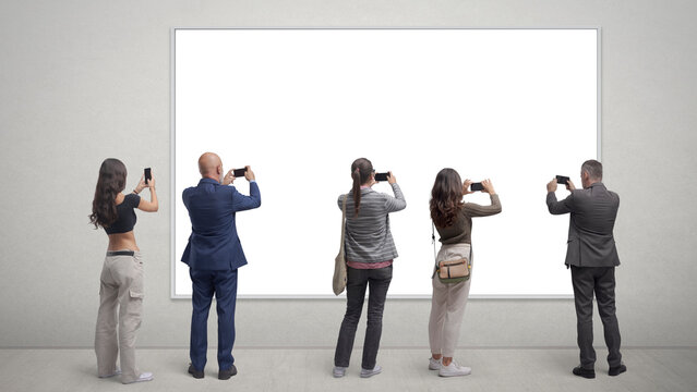 People taking pictures of a painting