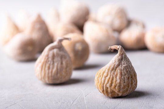 dried figs floured with rice flour. Selective focus on the foreground.