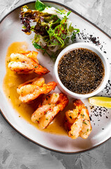 fried big tiger shrimp with sauce on plate