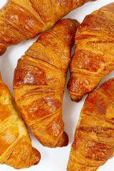 fresh tasty croissants isolated on white background