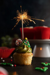 Christmas Cupcake with sparkler moody lifestyle image, home baking, sweet dessert