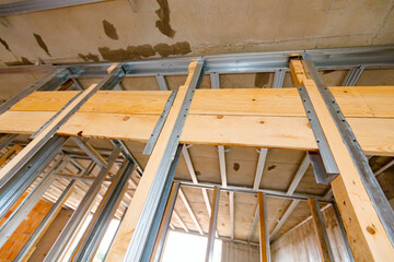 Frame for plasterboard wall, mounted vertical metal and wooden profiles, work in progress of...