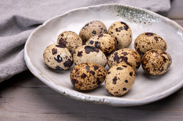 Fresh small spotted partridge or quail bird eggs