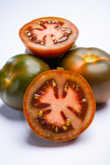 Fresh ripe sweet reddish brown and green kumato tomatoes