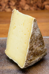 Pieces of cheese tomme de montagne or tomme de savoie made from cow milk in French Alps