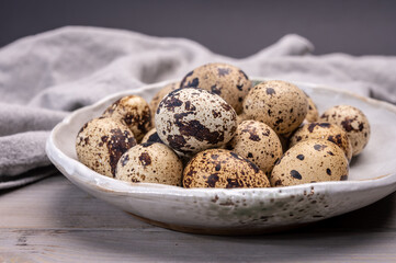 Fresh small spotted partridge or quail bird eggs