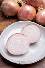 Bunch of french AOP pink onions from Roscoff village in Brittany, France