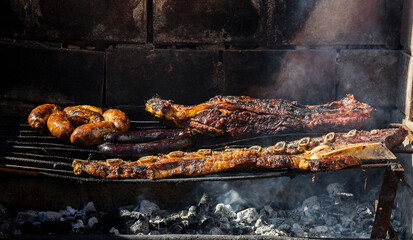 Barbecue, grilled sausages and cow meat , traditional argentine cuisine