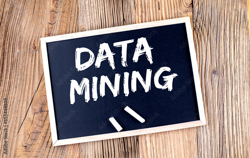 Poster data mining text on a chalkboard on the wooden background