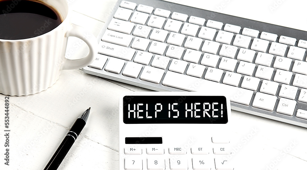 Poster help is here text on the calculator with keyboard and coffee