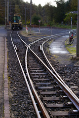 Fototapeta premium Close-up of railway switch of narrow gauge railway at train station Versam- Safien, Canton Graubünden, on a sunny autumn day. Photo taken September 26th, 2022, Versam, Switzerland.