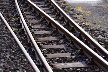 Naklejka premium Close-up of railway switch of narrow gauge railway at train station Versam- Safien, Canton Graubünden, on a sunny autumn day. Photo taken September 26th, 2022, Versam, Switzerland.
