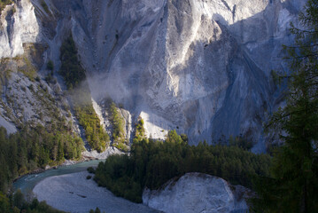 Aerial view of Rhine River with beautiful mountain panorama at Anterior Rhine Valley on a blue cloudy autumn day. Photo taken September 26th, 2022, Versam, Switzerland.