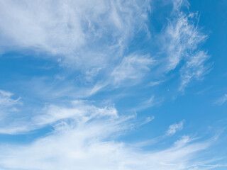 Blurred translucent clouds on the blue sky.