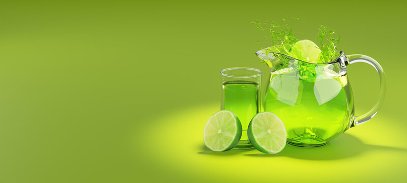 Half of a lime fruit dropped into a glass jug of lime juice making a splash