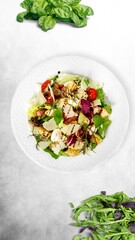 Tasty fresh fish vegetable salad in plate