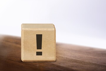 Big wooden cube or block with exclamation mark infographic