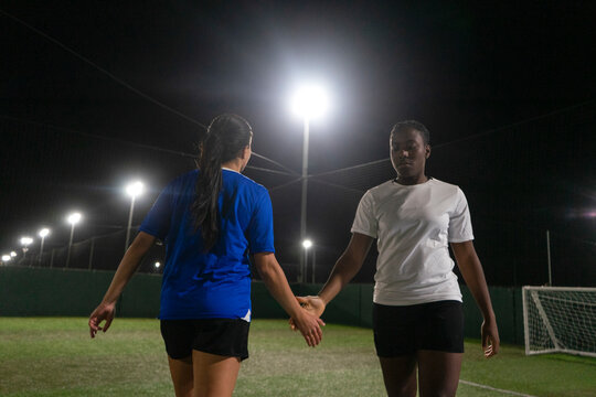 Young women playing soccer