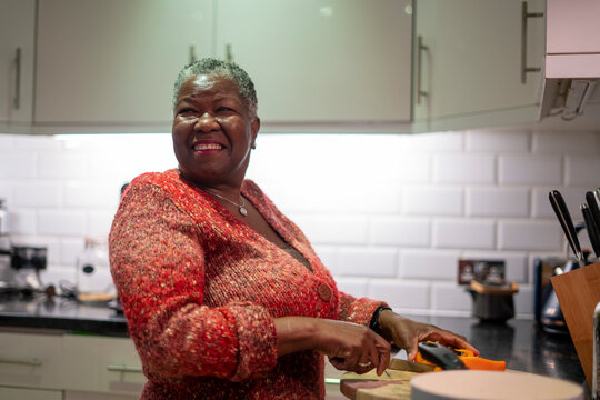 Senior Woman Preparing Food In Kitchen