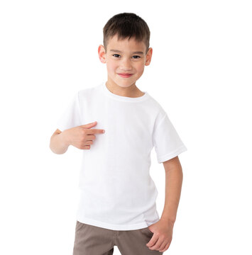 T shirt mock up. Cute little boy in blank white t-shirt with pointed finger isolated on a white background.