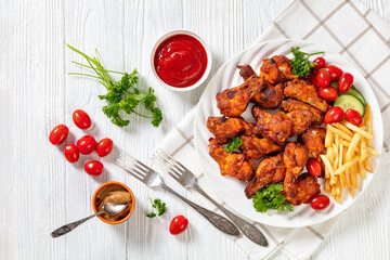 roast chicken wings with french fries and veggies