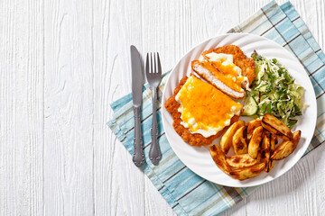 chicken parmo with coleslaw and roast potatoes