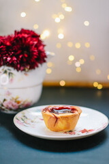 concept of the Breakfast with red jam cupcakes and tea