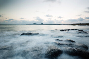 Sunset on the rocky shore.