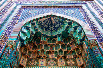 Traditional uzbek pattern on the ceramic tile on the wall of the mosque.